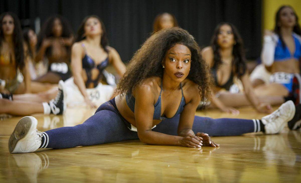  Brettnie Blake, stretches during auditions for a spot on next season's Heat dancers team.