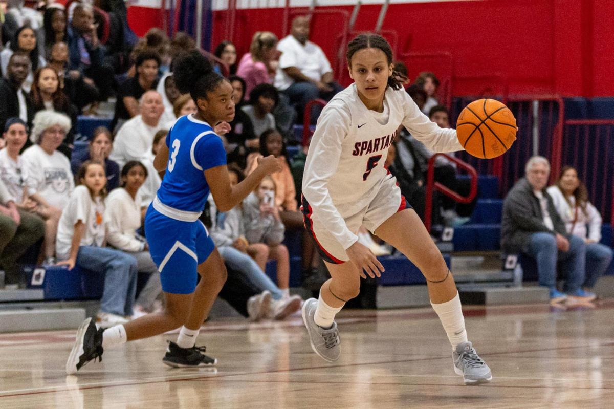 Miami Country Day guard Kaliyah Morales (5) dribbles past Somerset guard Sariyah Sabb (3) during a Regional 4-3A girls basketball final at Miami Country Day School in Miami, Florida on Thursday, February 22, 2024.