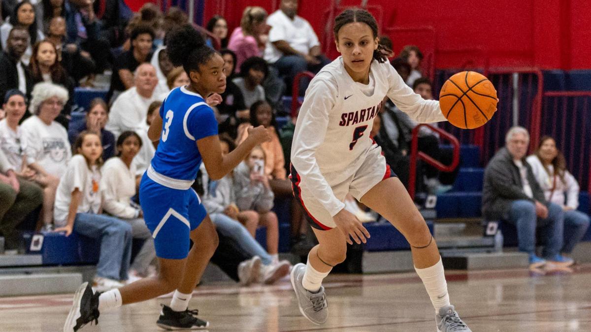 Miami Country Day guard Kaliyah Morales (5) dribbles past Somerset guard Sariyah Sabb (3) during a Regional 4-3A girls basketball final at Miami Country Day School in Miami, Florida on Thursday, February 22, 2024.