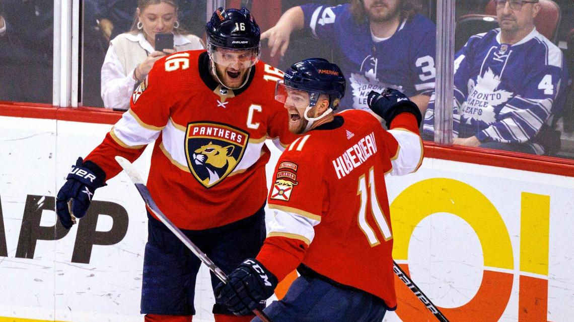 Florida Panthers left wing Jonathan Huberdeau (11) celebrates with teammate Aleksander Barkov (16) after scoring the winning goal against Toronto Maple Leafs goaltender Jack Campbell (36) during overtime of an NHL game at the FLA Live Arena on Tuesday, April 5, 2022 in Sunrise, Fl.