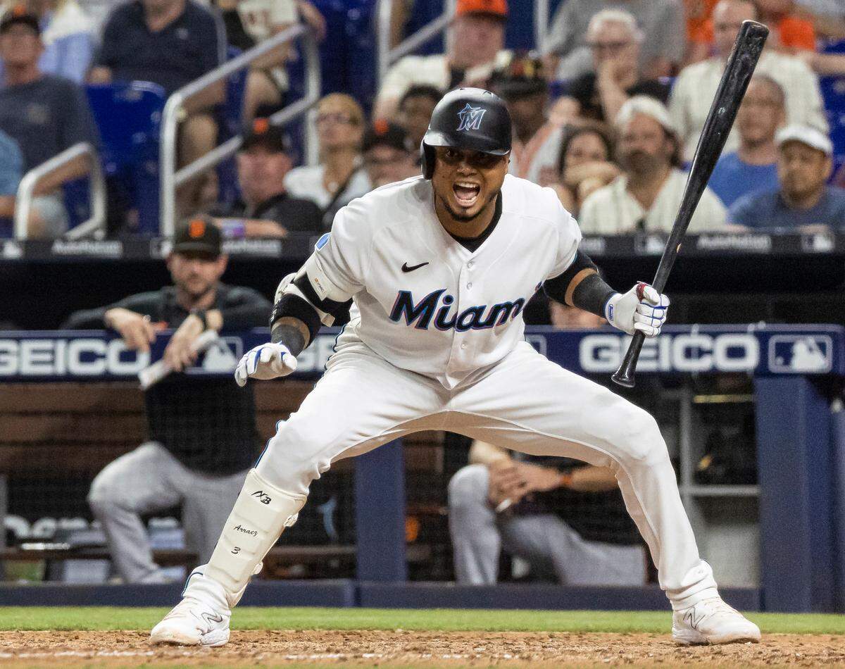Miami Marlins second baseman Luis Arraez (3) reacts after stopping himself from swinging at a pitch against the San Francisco Giants in the eighth inning of an MLB game at loanDepot park on Monday, April 17, 2023, in Miami, Fla.