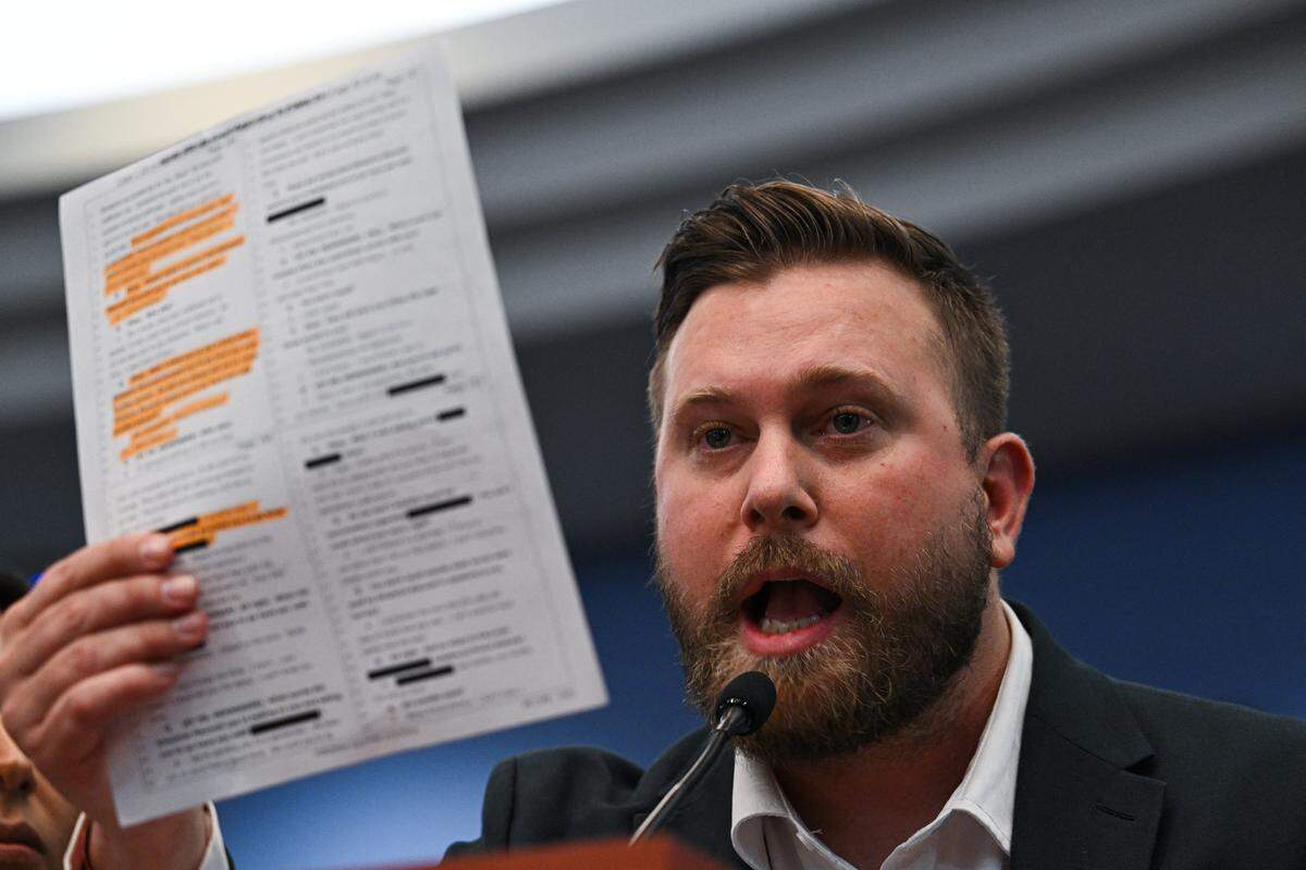 Sky Roberts, the brother of Virginia Giuffre, an accuser of Jeffrey Epstein who died by suicide last year, reads out an investigation report during a Democrat-led US House Oversight field hearing on the Epstein investigation in West Palm Beach, Florida, on May 12, 2026. 