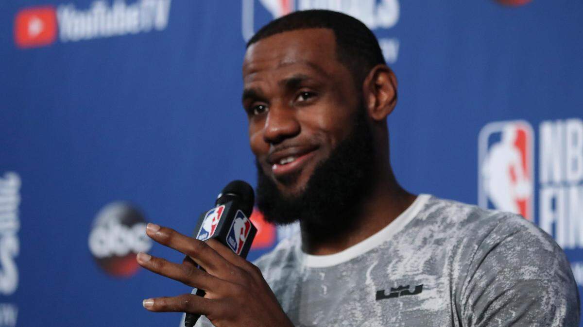 Cleveland Cavaliers forward LeBron James takes questions at a press conference after the basketball team's practice during the NBA Finals on Thursday, June 7, 2018, in Cleveland.