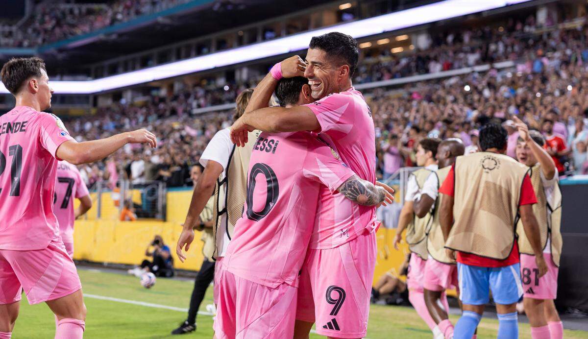 Inter Miami forward Luis Suárez (9) celebrates with forward Lionel Messi (10) after scoring a goal against Palmeiras in the second half of their Group A third-round FIFA Club World Cup soccer match at Hard Rock Stadium on Monday, June 23, 2025, in Miami Gardens, Fla.