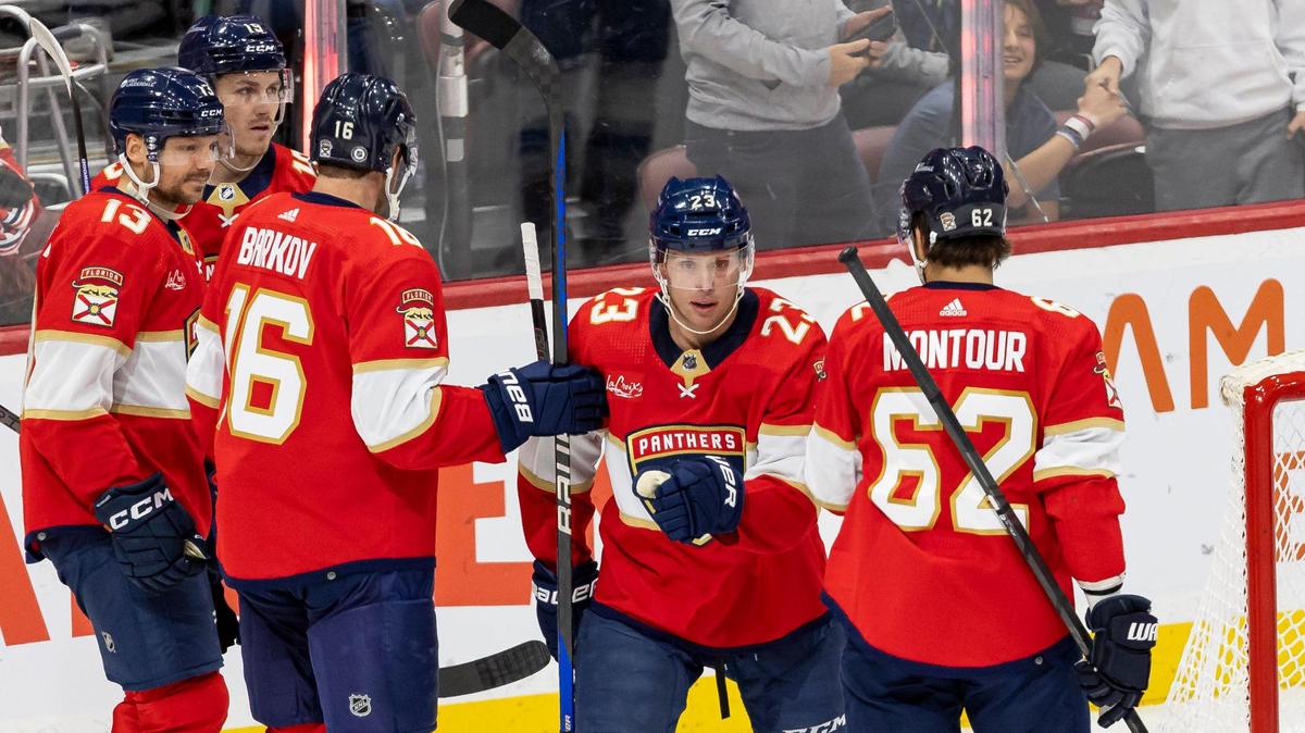 Florida Panthers center Carter Verhaeghe (23) celebrates with his teammates after scoring a goal against the Colorado Avalanche in the first period of their NHL game at the Amerant Bank Arena on Saturday, Feb. 10, 2024, in Sunrise, Fla.