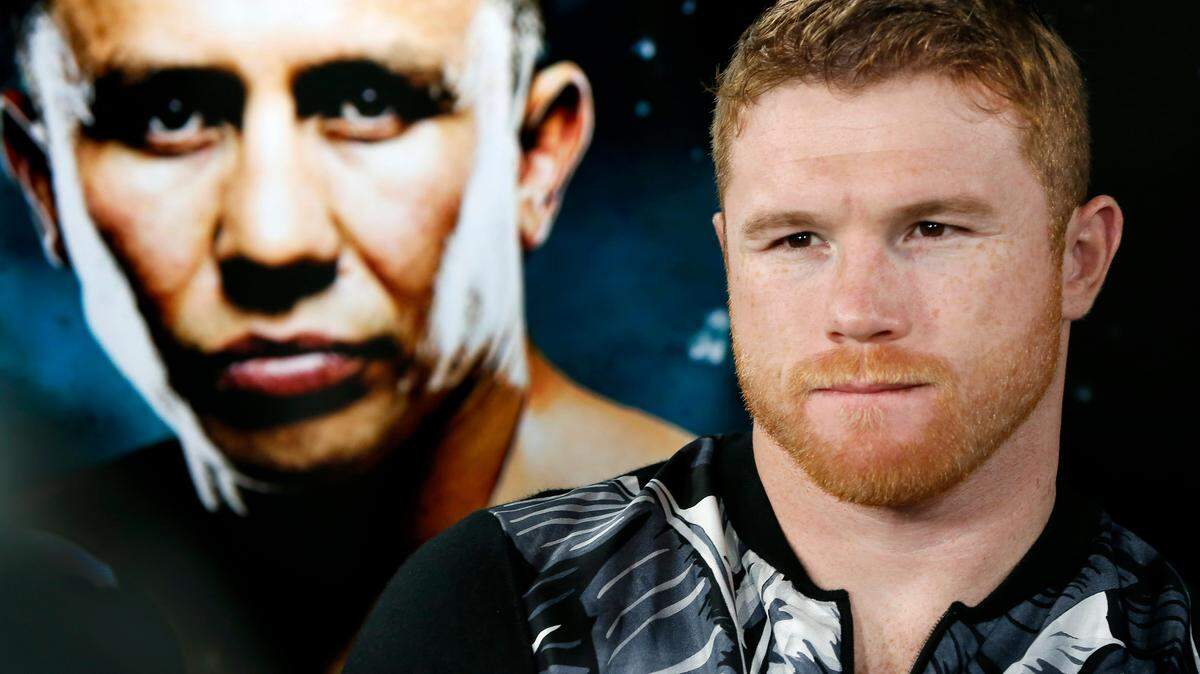Canelo Alvarez sits beside a giant photograph of his upcoming opponent, Gennady Golovkin, during an interview in New York. In the quiet calm of Canelo Alvarez’s training gym in a suburban office park, the Mexican superstar can escape the bitter emotions and sharp words surrounding his rematch with Gennady Golovkin.