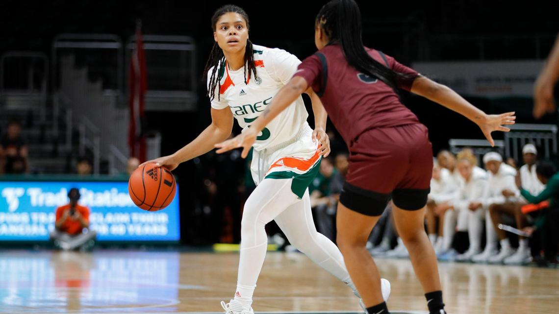 Miami Hurricanes forward Destiny Harden (3) dribbles the basketball as Maryland-Eastern Shore Lady Hawks guard Mya Thomas (5) defends during the first quarter of a basketball game at the Watsco Center in Coral Gables, Florida, Monday, November 7, 2022.