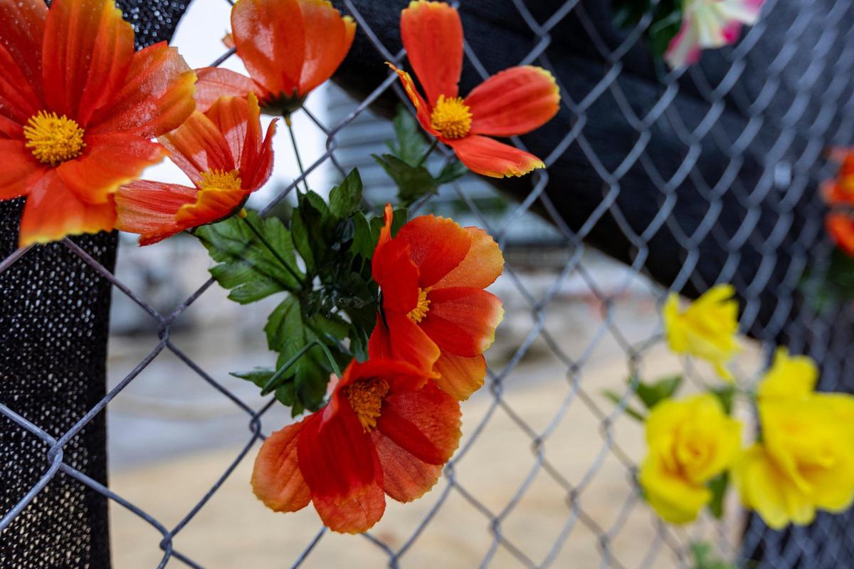 Plastic flowers at the site of Champlain Towers South, 88th Street and Collins Avenue in Surfside, June 22, 2023.