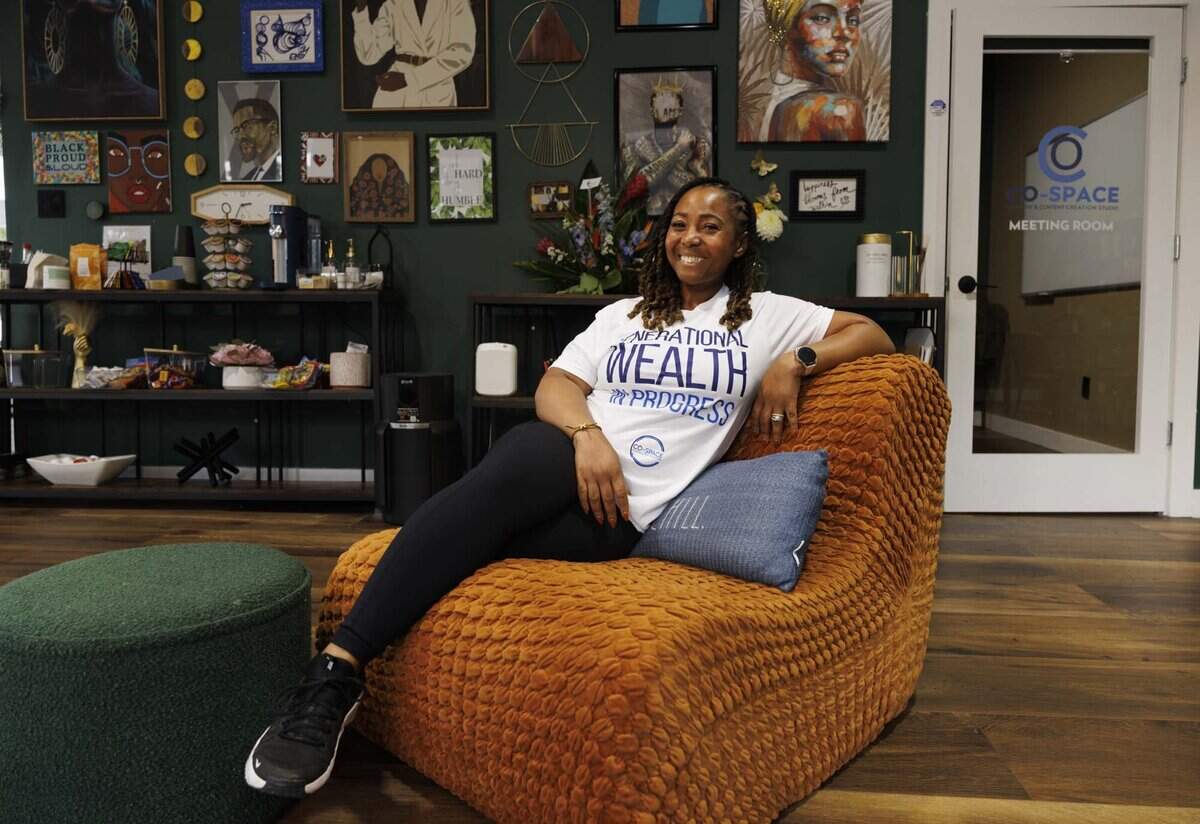 Joy St. Clair, founder of Co-Space, a co working space with a podcast studio and private meetings rooms, poses inside her business on Wednesday, June 3, 2026, in Miami Gardens, Fla. Co-Space gives many Black entrepreneurs and founders in South Florida a place to work where they feel seen.