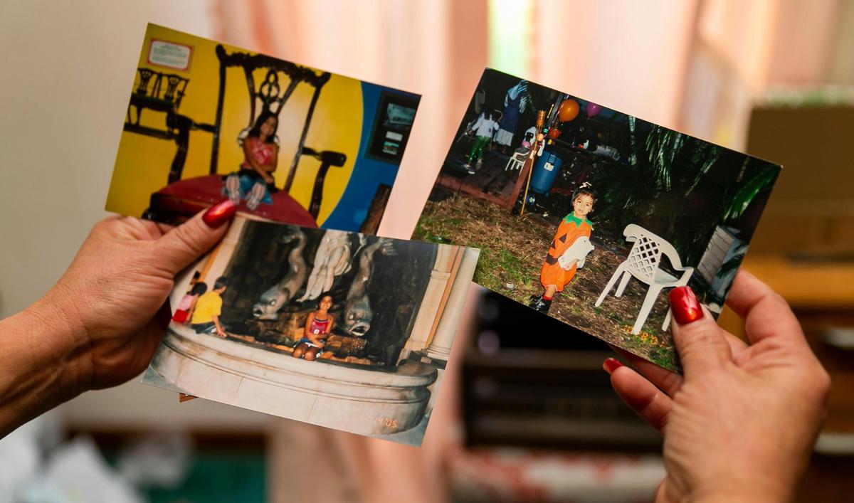 Gina Duran holds photos of her late daughter, Alexa, at her home in Miami-Dade. Alexa, an 18-year-old FIU freshman, was one of six people who died when the FIU bridge collapsed on March 15, 2018.