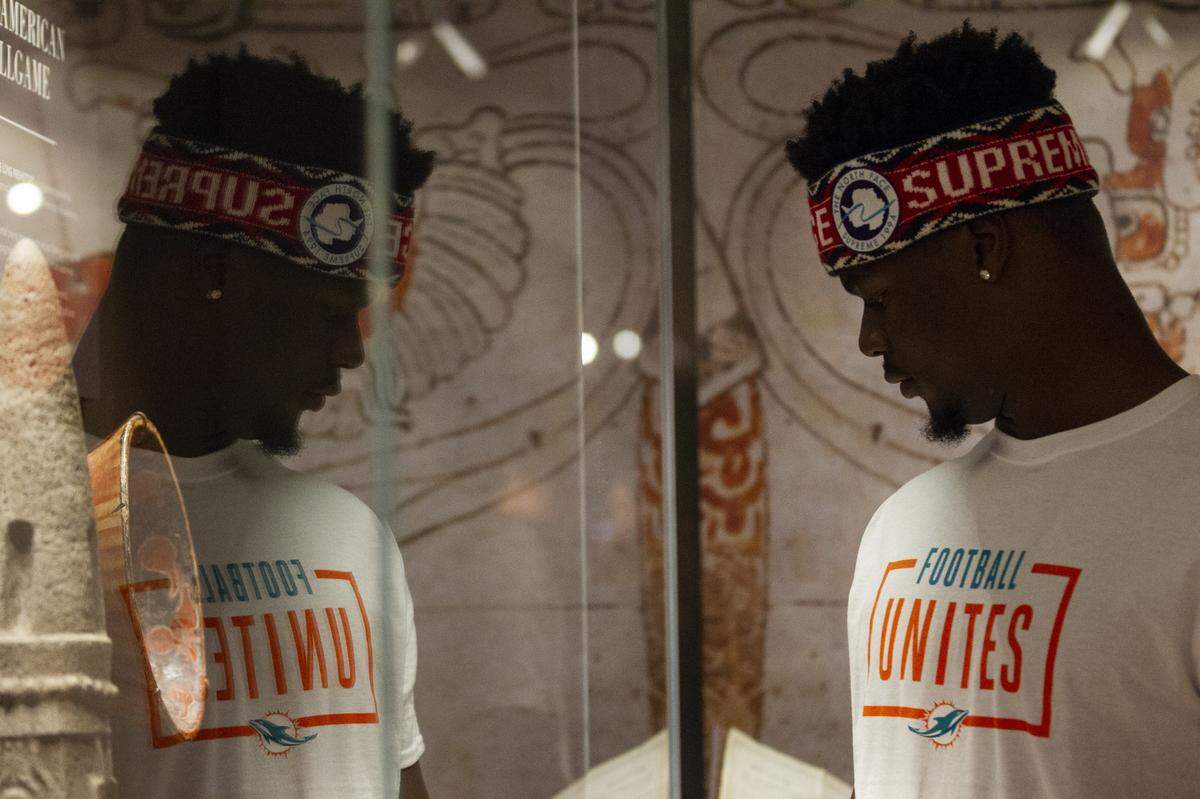 Miami Dolphins’ linebacker Jerome Baker (55) looks at an exhibit inside the Freedom Tower during the team’s Football Unites: Cultural Tours event on Tuesday, September 18, 2018. The event unites Miami Dolphins players, alumni and staff with community leaders and law enforcement to experience the cultural diversity of South Florida.