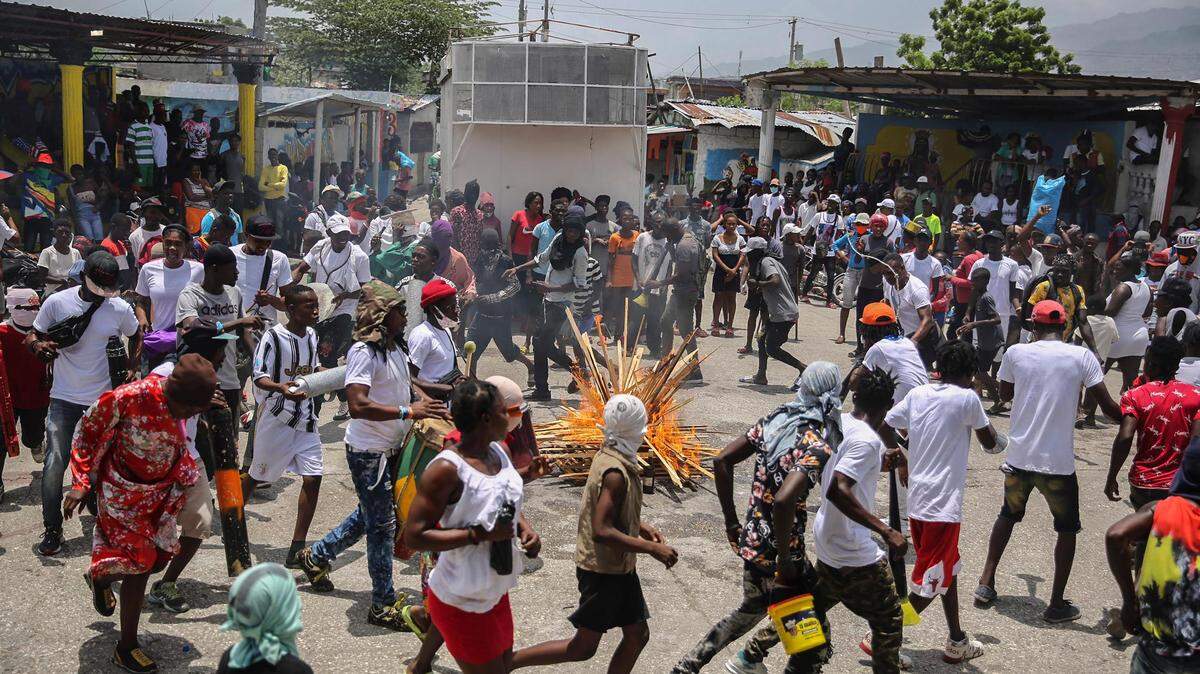 Haitians march to demand justice for slain President Jovenel Moïse in Lower Delmas, a district of Port-au-Prince, Haiti, on Monday, July 26, 2021. Moïse was assassinated on July 7 at his home.