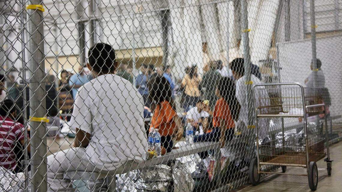 People who've been taken into custody related to illegal entry into the United States sit in one of the cages at a facility in McAllen, Texas, Sunday, June 17, 2018.