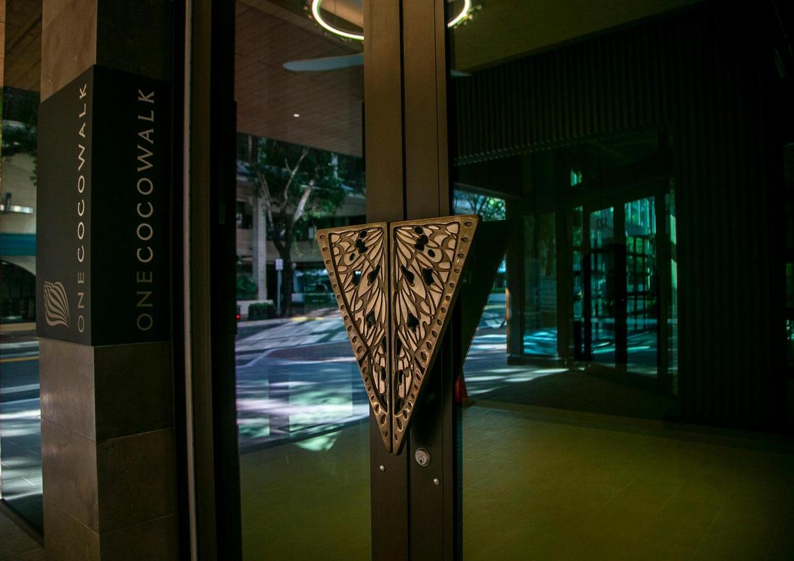 View of the entrance to CocoWalk’s glassy new wing with four floors of offices, Dec. 24, 2020.