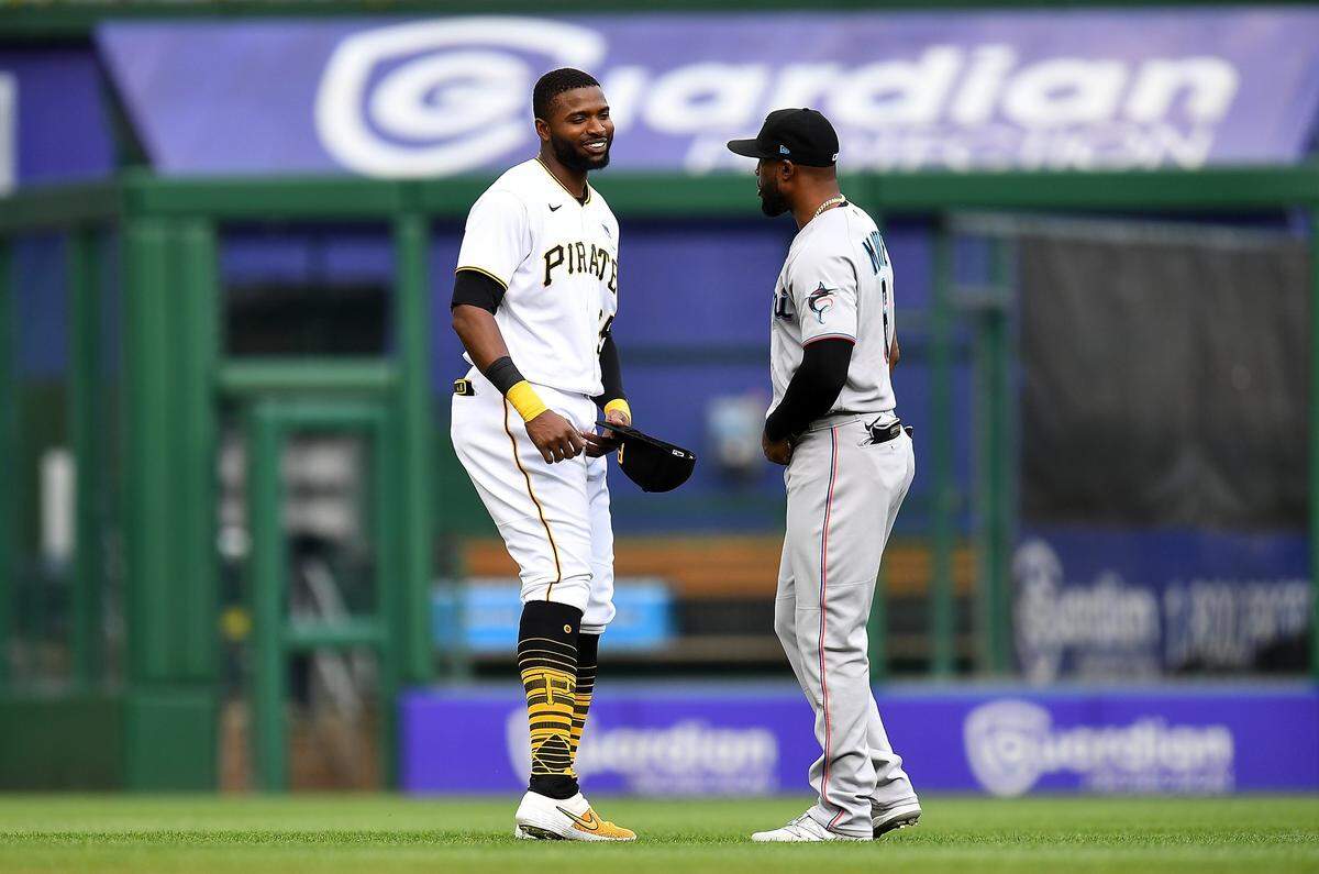 PITTSBURGH, PA - JUNE 03: Gregory Polanco #25 of the Pittsburgh Pirates talks with Starling Marte #6 of the Miami Marlins prior to the game at PNC Park on June 3, 2021 in Pittsburgh, Pennsylvania. (Photo by Joe Sargent/Getty Images)
