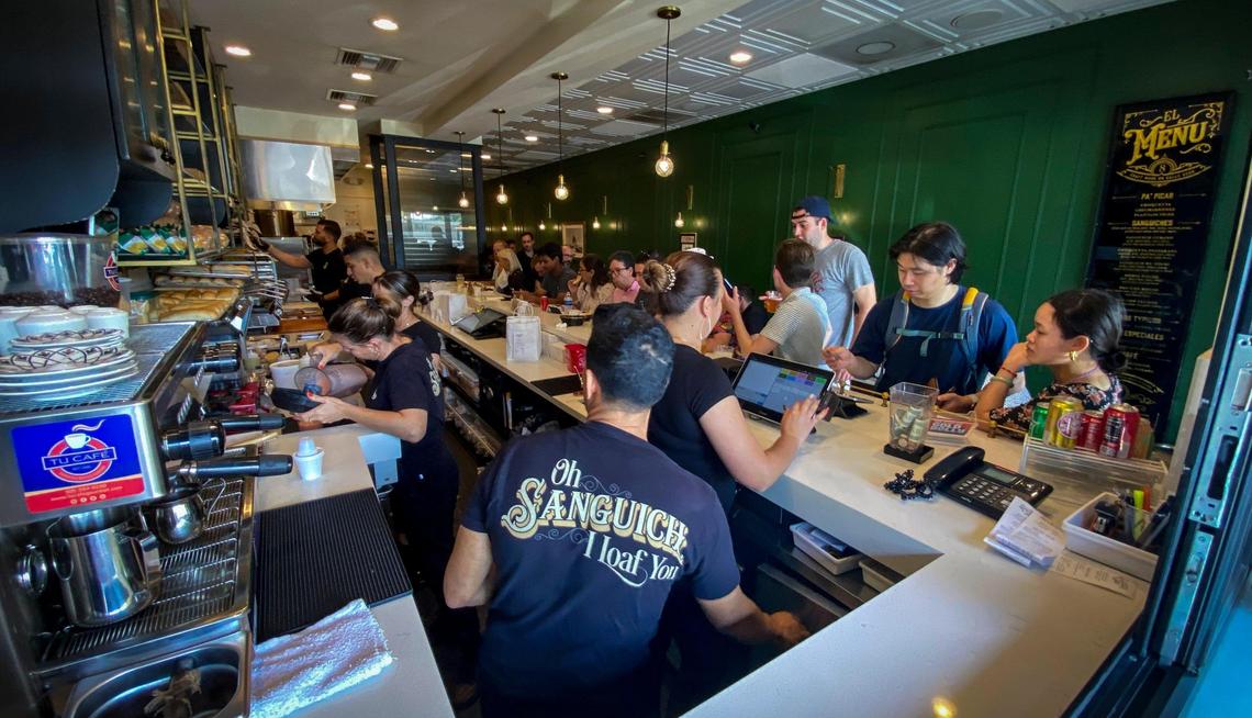 The busy interior of Sanguich de Miami, which was honored as a Bib Gourmand restaurant earlier this year by the Michelin Guide.