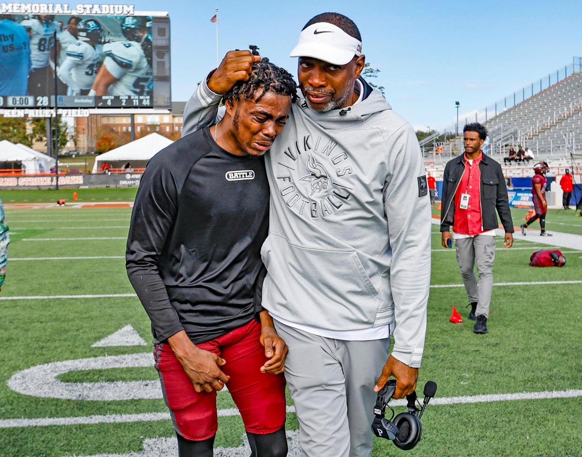 Norland High coach Daryle Heidelburg consoles wide receiver Joaquin Reid (8) react as the Vikings lose the FHSAA State Championship game to the Berkeley Prep Buccaneers Class 2M, at Bragg Memorial Stadium in Tallahassee, Florida, on Saturday, December 9, 2023.