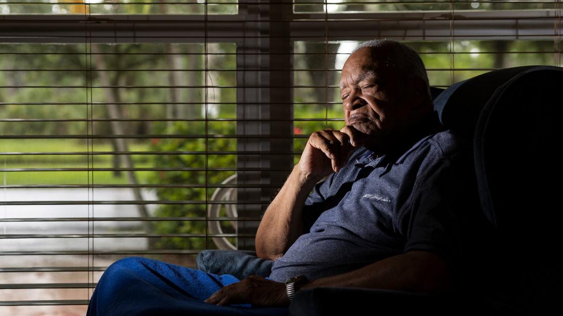 David Lawrence Adderley, 86, sits near the window of his home in Miami-Dade on Thursday, Aug. 29, 2024. He alleges 3ABN executives misled him into signing away some 400 acres in the Bahamas that had been in his family for four generations.