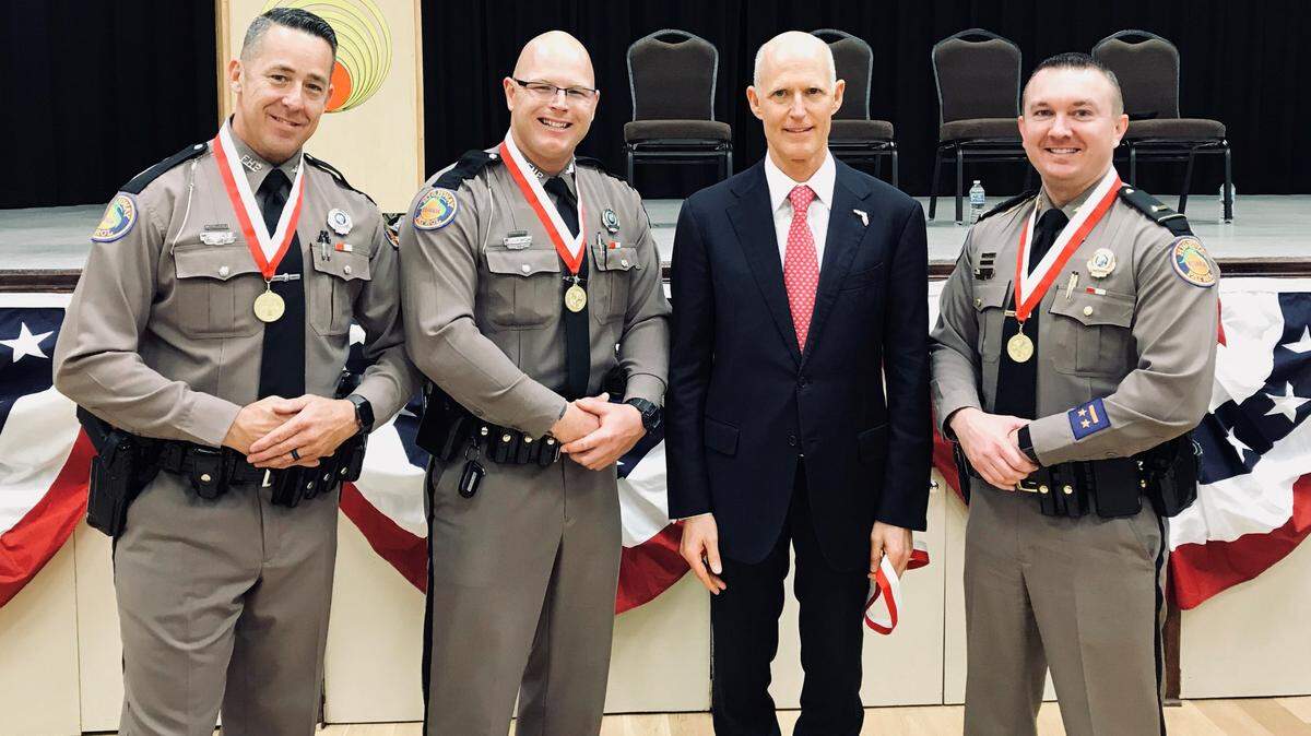 Former Florida Highway Patrol Trooper Michael Lipari, left, received the Governor’s Veterans Service Award from Gov. Rick Scott in 2018.