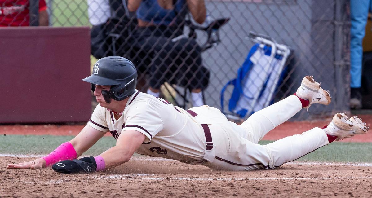 Marjory Stoneman Douglas Eagles’ Devin Fitz-Gerald (3) slides into home plate after Eagles’ Niko Benestad (6) hit a single against the West Broward Bobcats’ in the third inning of their Region 4-7A baseball final at Anthony Rizzo Field on Monday, May 13, 2024, in Parkland, Fla.