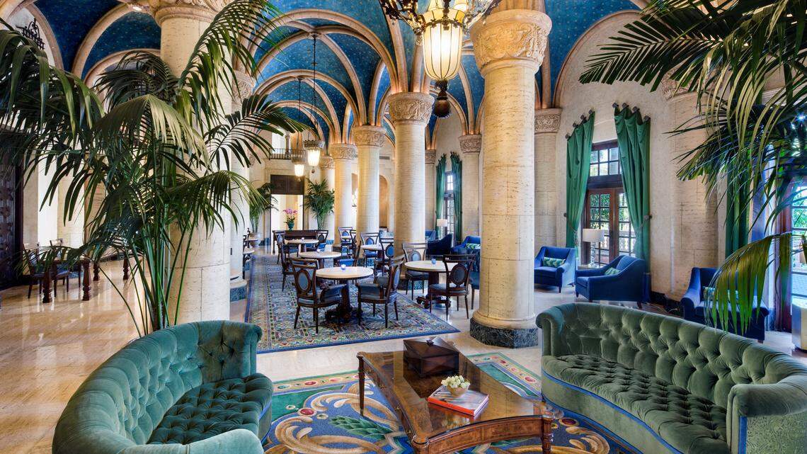 The renovated lobby at the Biltmore Hotel in Coral Gables features a new green and blue color scheme with custom-built velvet furniture.