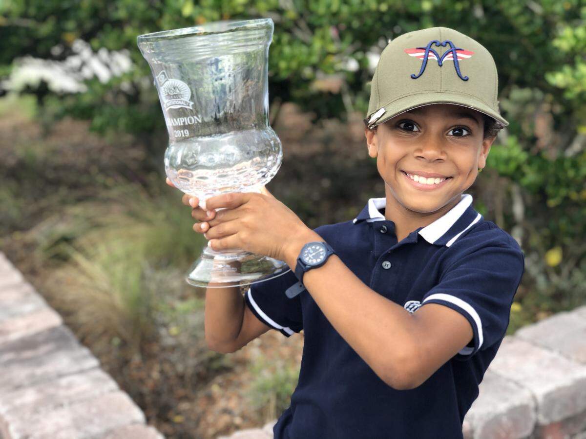 Axel Monssoh holds high his winning trophy at the 2019 PGA Club Invitational. 