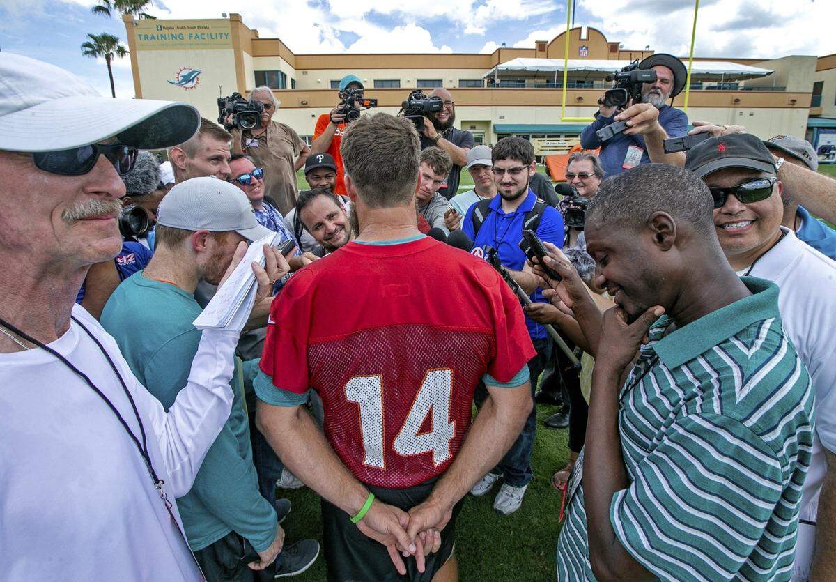Miami Dolphins quarterback Ryan Fitzpatrick (14) speaks to the media after Miami Dolphins practice at Baptist Health South Florida Training Facility in Davie on Thursday, July 25, 2019.