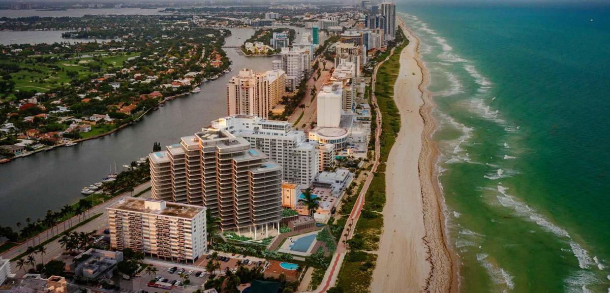 An architectural rendering shows an aerial view of a proposed new pyramid-shaped luxury condo designed by OMA that would replace the 1964 La Costa condominium at 5333 Collins Ave., Miami Beach.