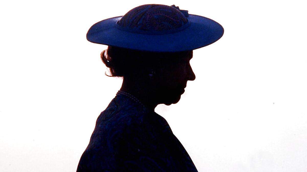 Britain’s Queen Elizabeth II silhouetted during welcoming ceremonies at the airport in Barbados around March 8, 1989. Queen Elizabeth II, Britain’s longest-reigning monarch and a rock of stability across much of a turbulent century, has died. She was 96.