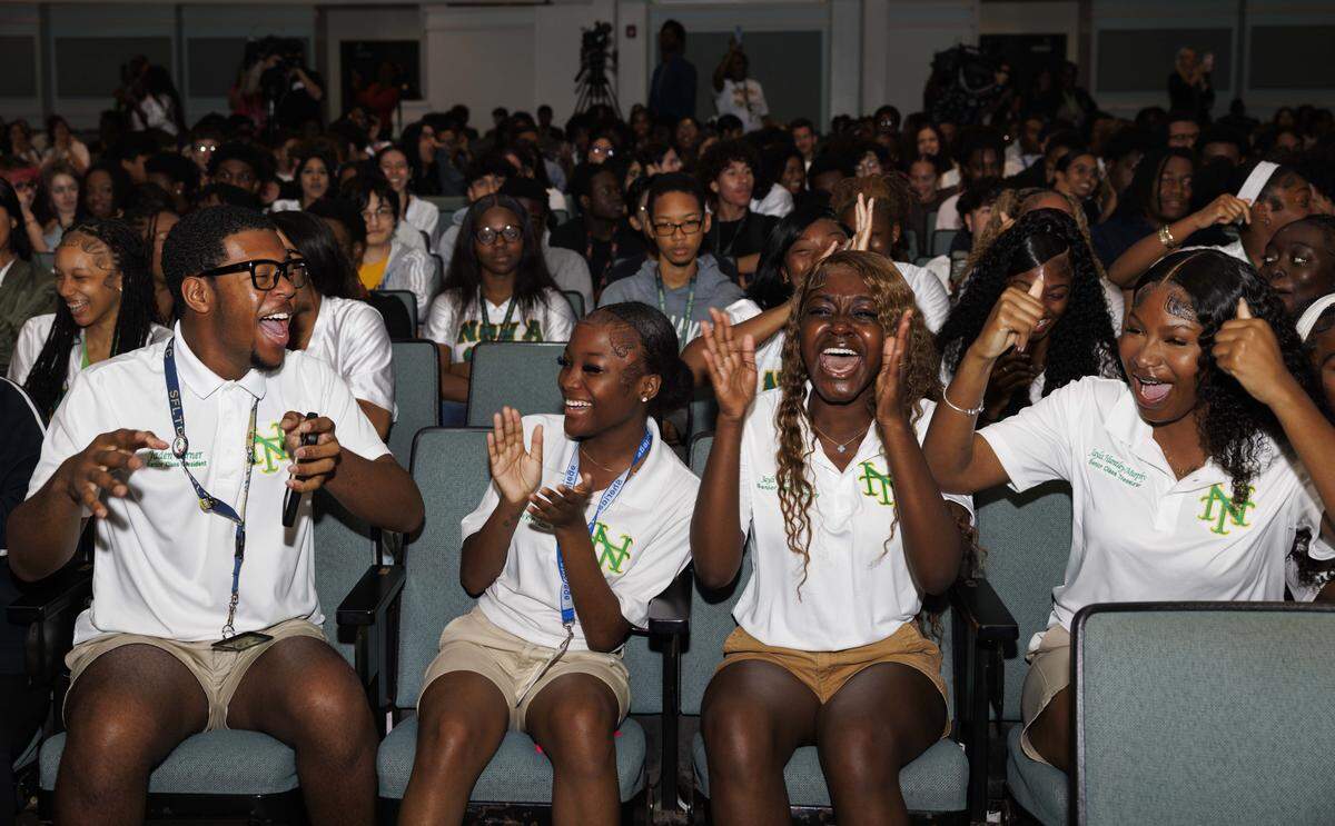 Senior class council from left to right: Jaden Turner, president, Amaya Henry, vice president, Jayli Exceus-Asante, secretary, and Jayla Huntley-Murphy, treasurer, react to hearing that prom tickets will be free for students during a ceremony with the senior class announcing that Becca’s Closet and Macy’s donated $65,000 so that prom would be free for students on Thursday, March 26, 2026, at Nova High School in Davie, Fla. “I’ve been president since sophomore year, and it made me feel relieved [that] I had this weight lifted off my shoulders. I’m just grateful that everyone will get to experience something as big as prom,” said Turner. “The money from our balance is split between the remaining classes so it will continue to help in years to come.”