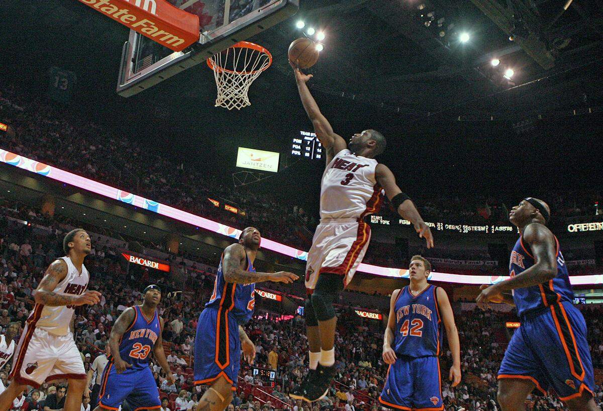 Miami Heat guard Dwyane Wade goes to the basket for two points during the second quarter during an NBA basketball game against the New York Knicks on Sunday, April 12, 2009 at AmericanAirlines Arena in Miami.