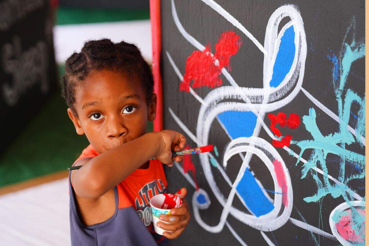 Programming for Art + Mind Day at the Arsht Center is intentionally meant to connect the mind, body and soul through the performing and visual arts. Participants at last year’s Art + Mind Day at the Arsht leave their mark on the Mind Day mural.
