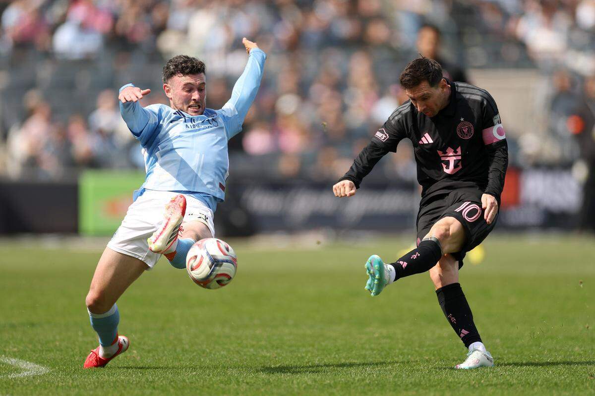 NEW YORK, NEW YORK - MARCH 22: Lionel Messi #10 of Inter Miami CF shoot whilst under pressure from Aiden O'Neill #21 of New York City FC during the MLS match between New York City FC and Inter Miami CF at Yankee Stadium on March 22, 2026 in New York, New York. (Photo by Sarah Stier/Getty Images)