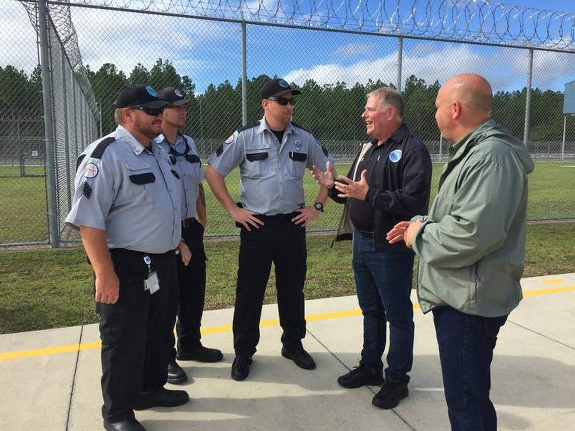 Florida Department of Corrections Secretary Mark Inch speaks with corrections officers at Suwannee Correctional Institution during the evacuation of inmates in advance of Hurricane Dorian.
