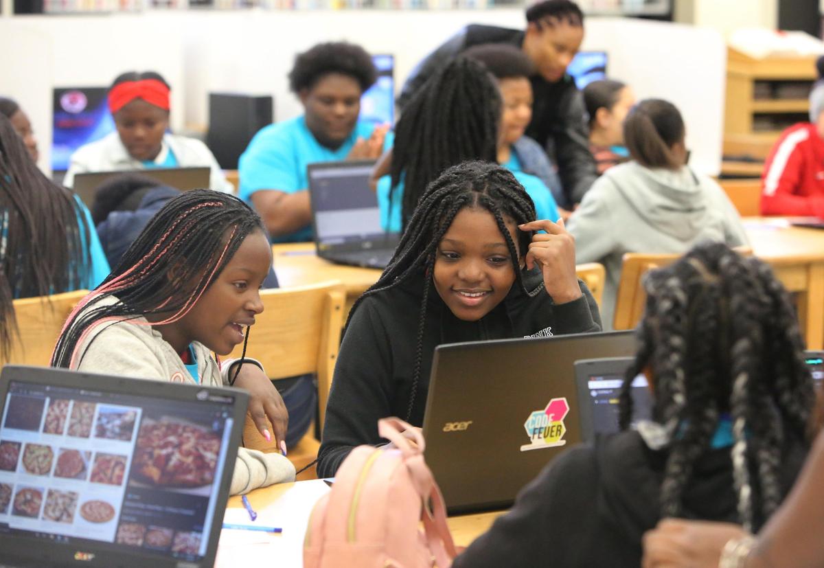 Tasharia Washington,12 and Jailah Sarrette, 12, students at Jose De Diego Middle School, learn to code with the help of Code Fever at thier school January 30, 2020. The special coding class for girls was part of the KickGlass Sports Meets Tech Camp, a program designed to introduce football and technology to young girls.