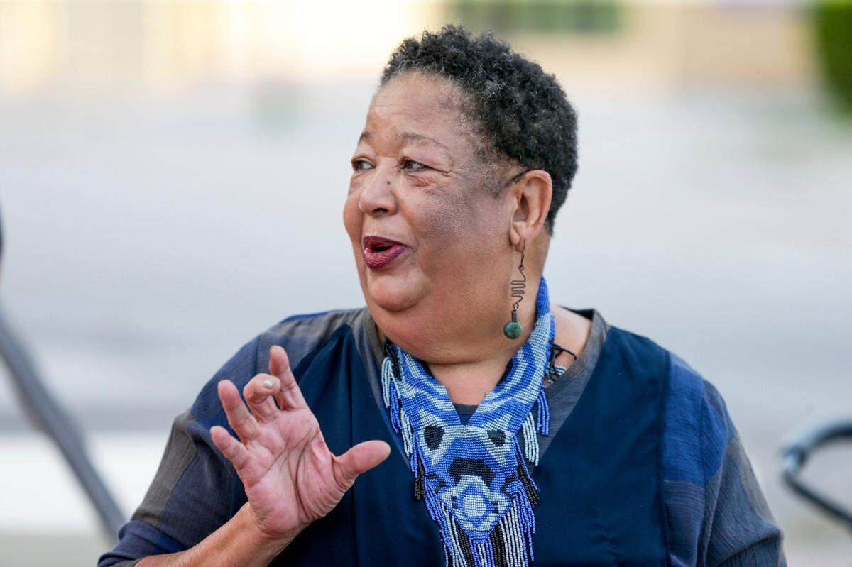 On Wednesday, July 21, 2021, Femi Folami-Browne, 68, talks about her life growing up in Opa-locka and how that inspired her to write the poem later selected as part of the Opa-Locka Light District. The poem is projected on a sidewalk in Opa-locka, Florida.