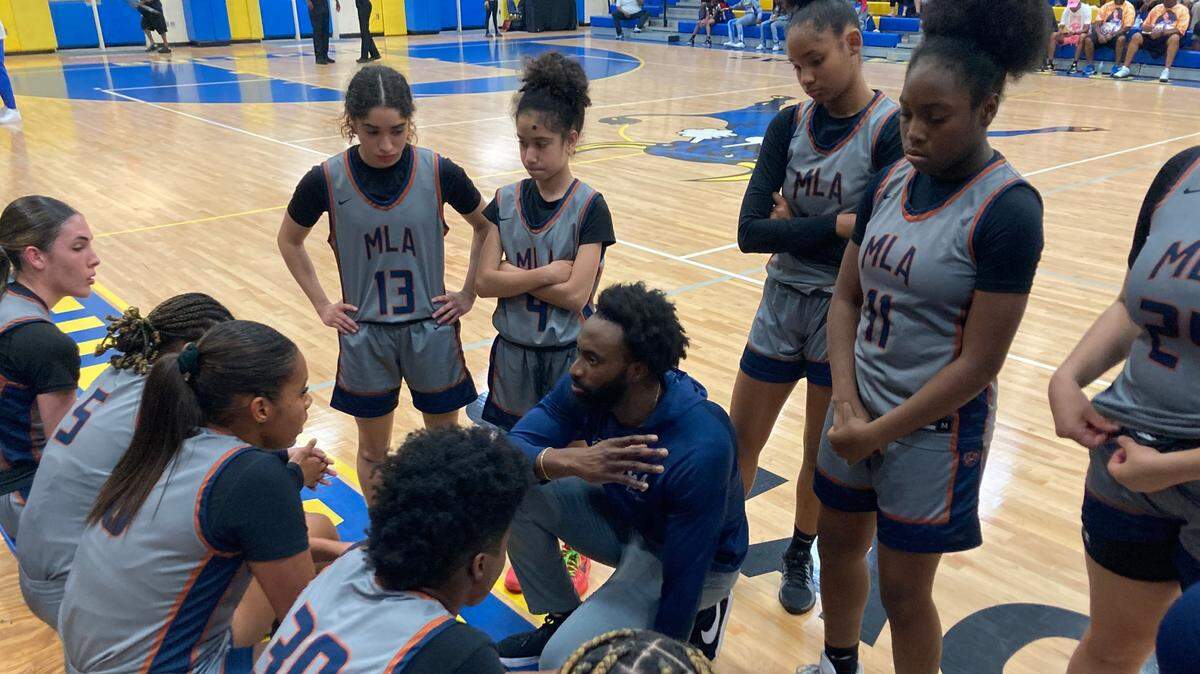 Mater Lakes coach Freddie Bitondo gives his players a pep talk during a first half timeout in Tuesday’s Region 4-4A girls’ basketball semifinal.