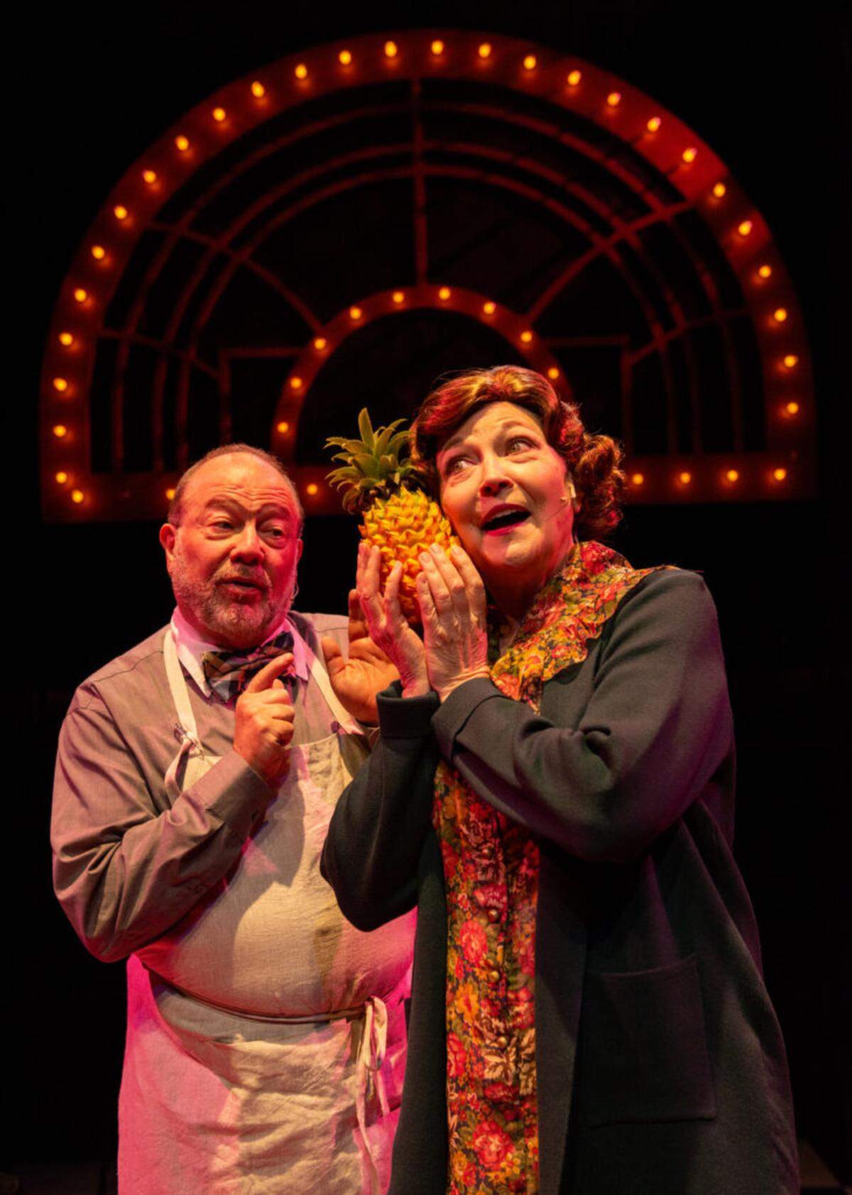 Real-life husband and wife Avi Hoffman and Laura Turnbull wax poetic on a pineapple in the song “It Couldn’t Please Me More.”