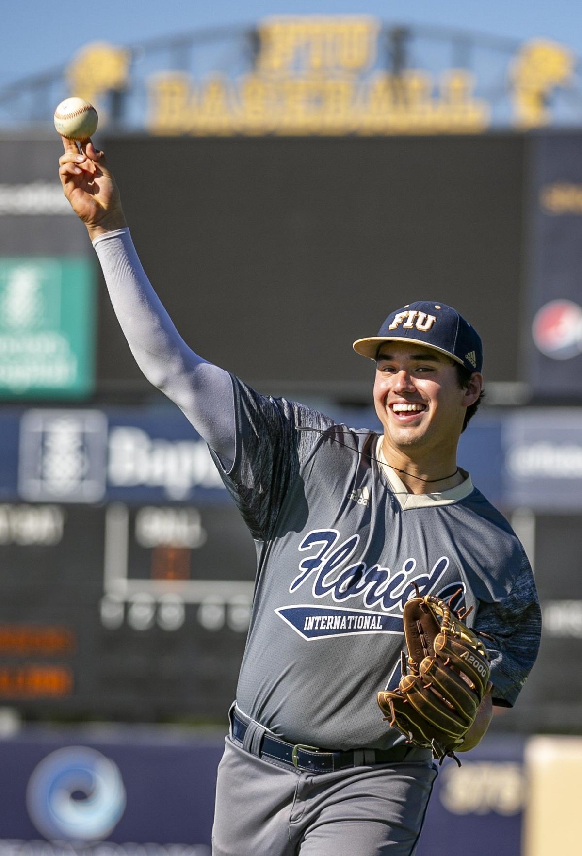FIU third baseman Austin Shenton throws during warmup drills on Thursday, Feb. 7, 2019.
