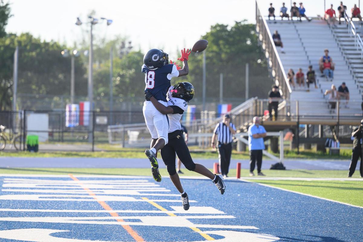 Columbus High School wide receiver Khamari Marcus (8) scores a touchdown during the game at Tropical Park on Friday, Nov. 29, 2024 in Miami, Fla. (Ruben Gonzalez/Miami Herald)