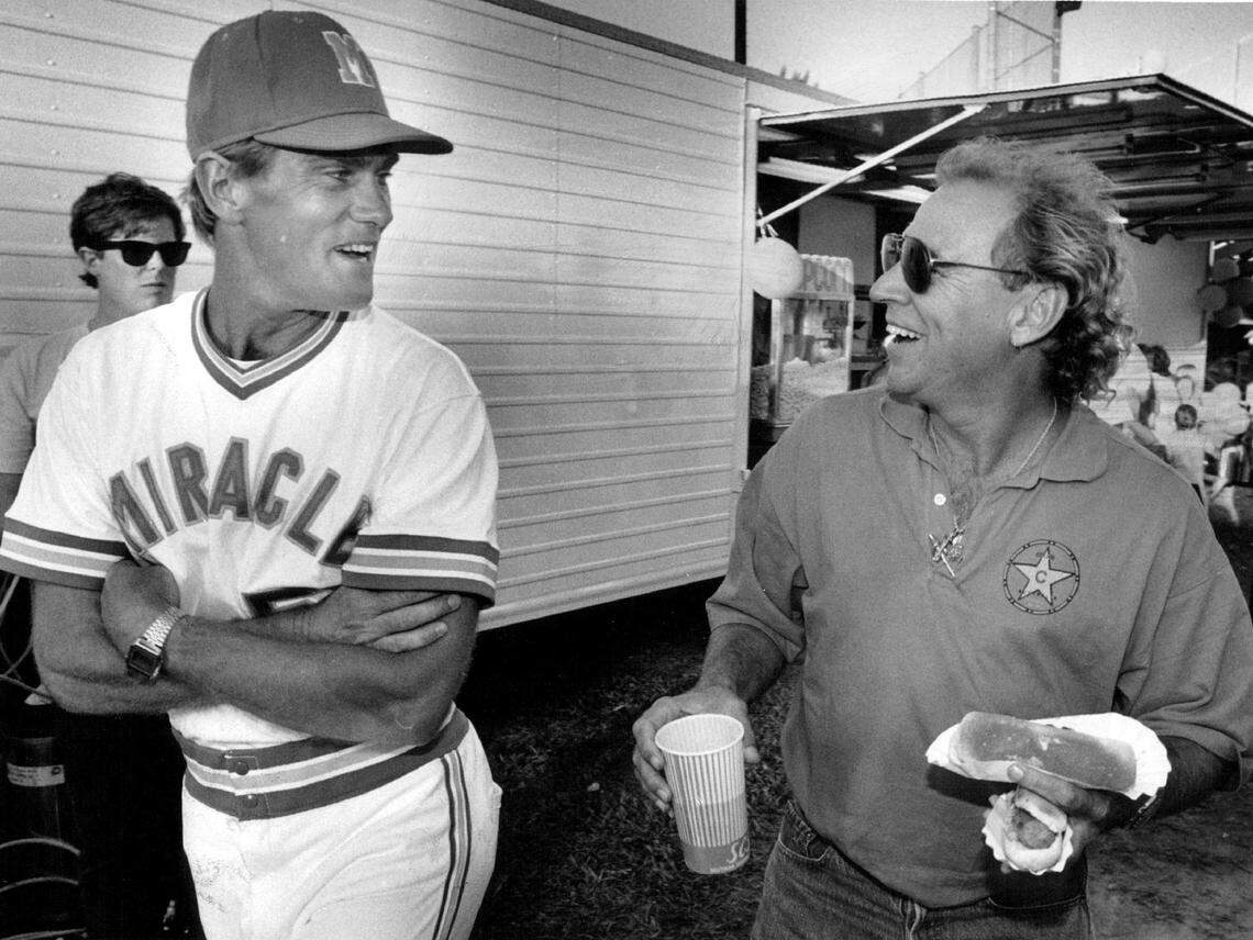 As one of the owners of the Miami Miracles minor league baseball team, Jimmy Buffett chats with manager Jim Gattis during opening night of the 1989 season. 