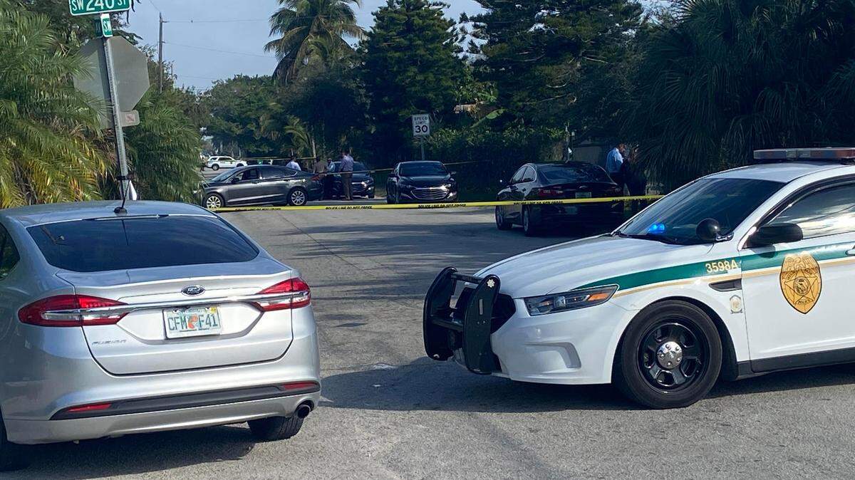 Miami-Dade police officers and detectives work a taped off crime scene at Southwest 248th Street and 240th Avenue in Southwest Miami-Dade County, where a woman’s body was found Tuesday morning, Feb. 8, 2022.