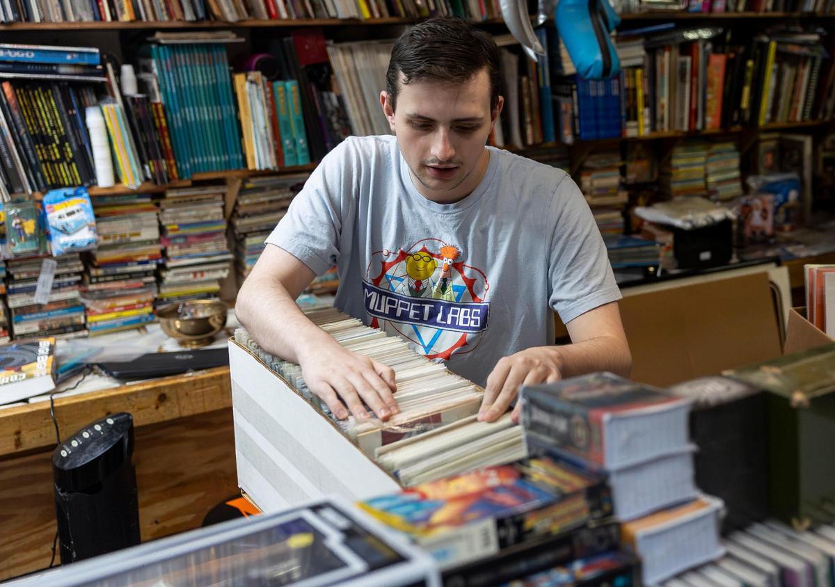 Customer Tucker Owens, 20, browses through Marvel’s Guardians of the Galaxy comics for sale at A&M Comics and Books on Friday, Jan. 24, 2025, in Miami, Fla.