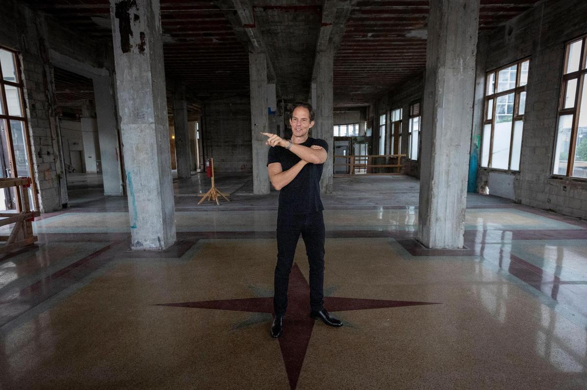 Developer Michael Shvo stands on the terrazzo floor in the lobby of the gutted South Beach landmark Raleigh Hotel, which he bought for $103 million in 2019. Shvo is spending $500 million more to restore the 1940 Art Deco hotel and two smaller, abutting historic hotels, while adding a luxury condo tower in the rear.