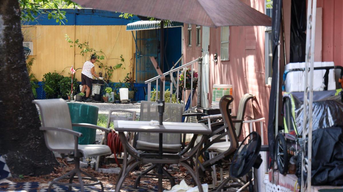Brownsville’s Blue Belle trailer park is in the area that the City of Hialeah is considering annexing. A resident waters her plants outside her trailer on Thursday, May 11, 2023.