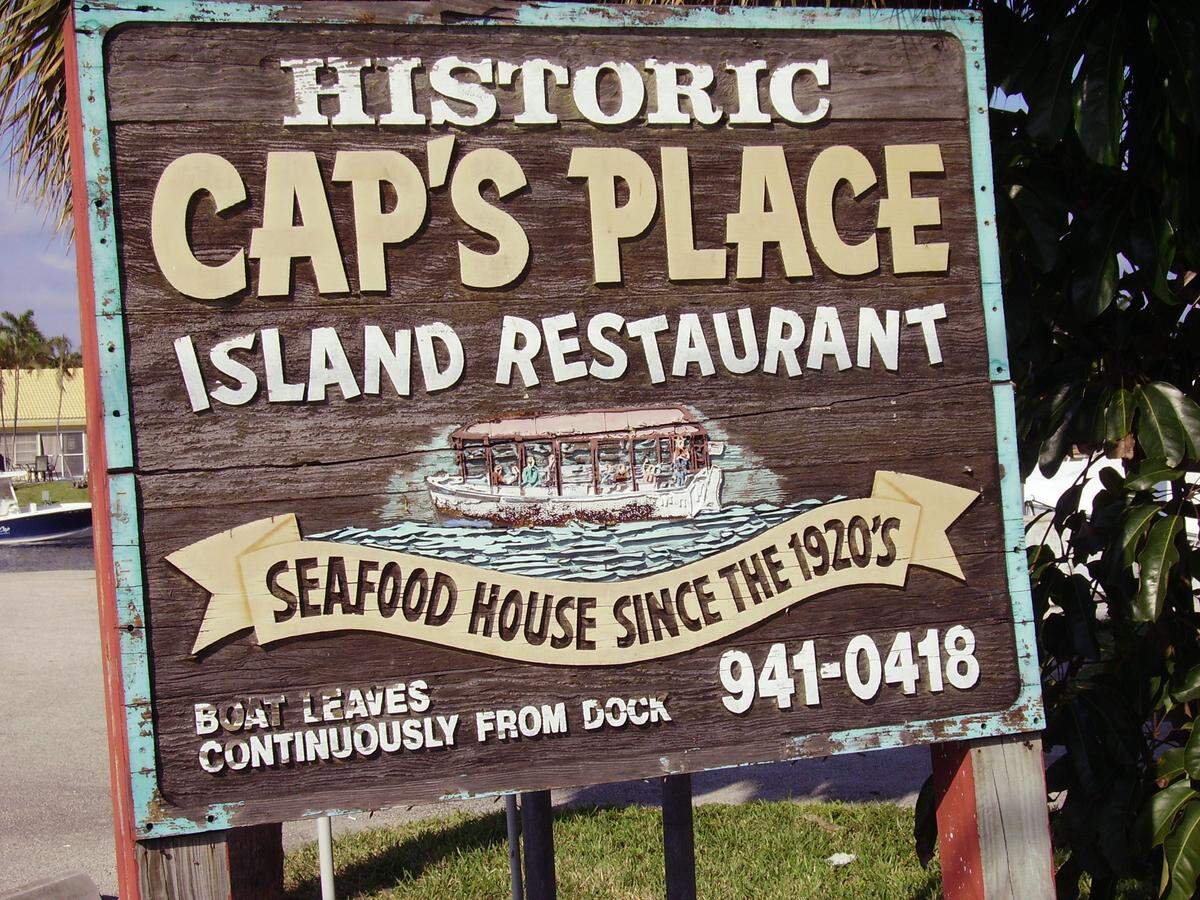 Cap’s Place Island Restaurant in Lighthouse Point. The restaurant, established in 1928, sits on a small strip of land that juts out between the Intracoastal Waterway and one of its estuaries. It has a past so storied that it’s listed on the National Register of Historic Places.