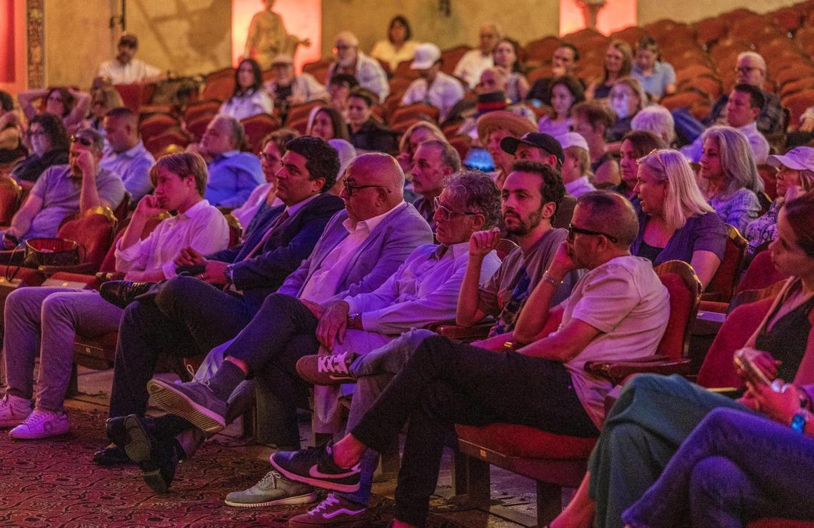 Attendees listen during a meeting hosted by the city of Miami to discuss the proposed sale of the Olympia Theater to a public charter school on Wednesday, July 16, 2025.