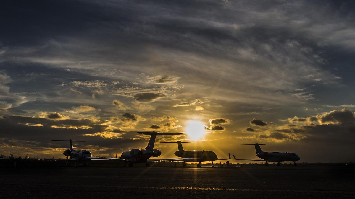 The sun sets over the airfield at Fontainebleau Aviation on Monday November 19, 2018. Fontainebleau Aviation is a private jet service operating at Opa-locka airport.