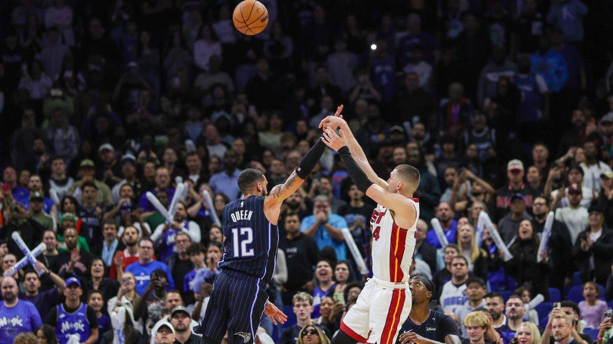 Miami Heat guard Tyler Herro (14) shoots the winning basket during the second half against the Orlando Magic at Kia Center.
