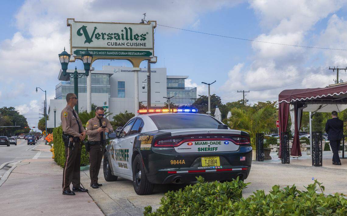 Miami-Dade Sheriff's Office officers guard the perimeter around the Versailles Cuban Cuisine restaurant in Little Havana, ahead of a visit by U.S. Congressman Byron Donalds for an “Ask Byron Anything” meet-and-greet event as part of his campaign to run in the 2026 Republican primary for Florida governor, on Monday, March 02, 2026.